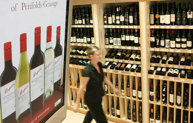 A woman walks into a wine store in central Sydney, Australia.