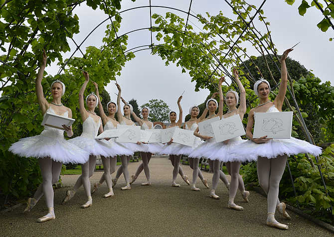 Members of the English National Ballet pose with canvases outside The Orangery at Kensington Palace in London.