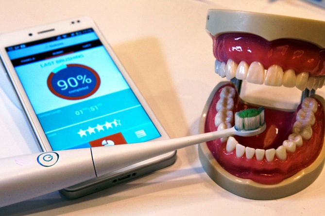 A Kolibree connected electric toothbrush is displayed during the 2014 International Consumer Electronics Show (CES) in Las Vegas, Nevada, January 8, 2014.