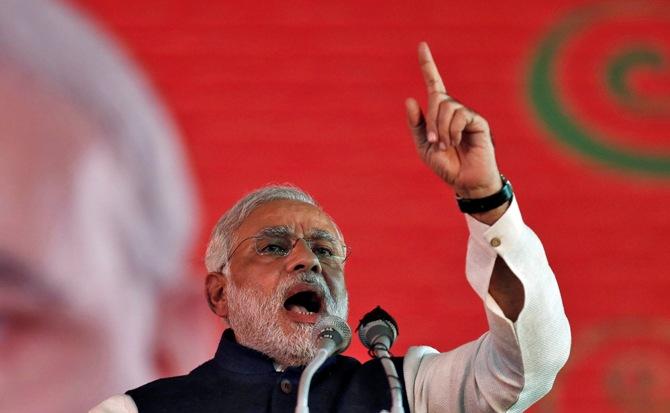 Narendra Modi, prime ministerial candidate for Bharatiya Janata Party and Gujarat Chief Minister, speaks during BJP's national council meeting at Ramlila ground in New Delhi January 19, 2014.