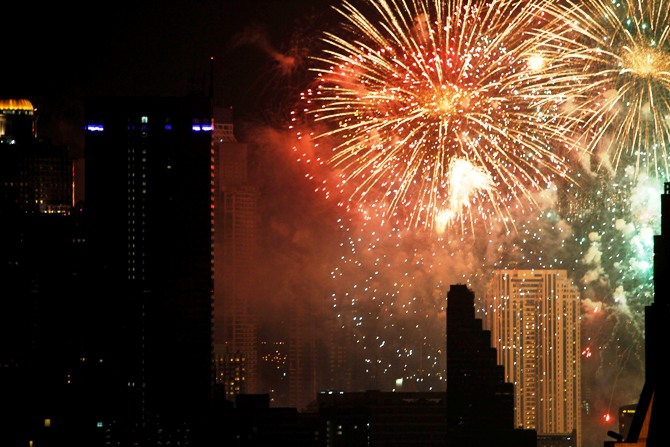 Fireworks explode during New Year celebrations over the city centre of Thailand's capital Bangkok.