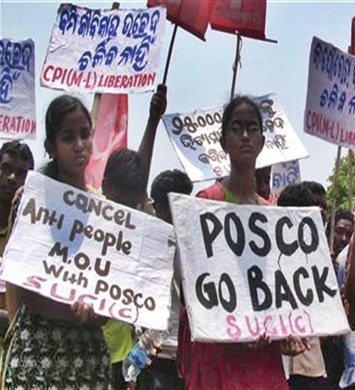 Villagers hold placards during a protest in Orissa.