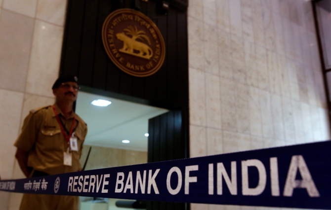 A security guard stands in the lobby of the Reserve Bank of India headquarters. 