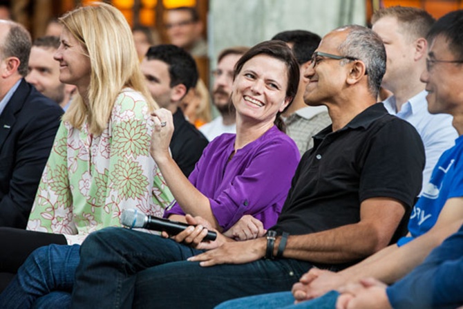 Senior Microsoft executives Tami Reller (left), Amy Hood, Satya Nadella and Qi Lu participate in a One Microsoft Town Hall event.