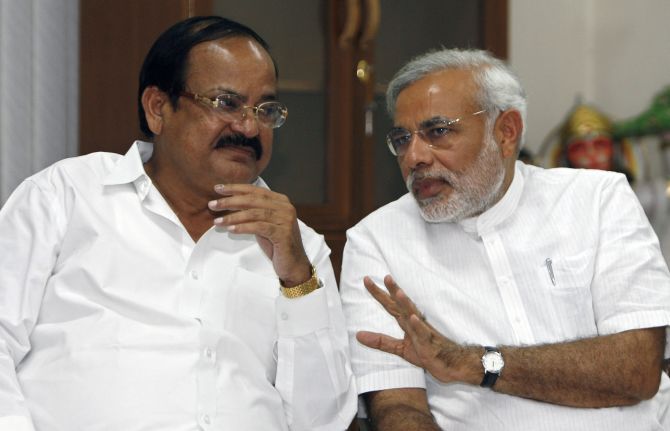 Venkaiah Naidu (L) and Narendra Modi attend a party meeting in New Delhi.
