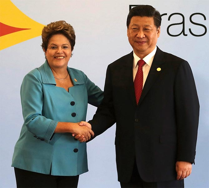 Brazil's President Dilma Rousseff shakes hands with China's President Xi Jinping before the 6th BRICS summit in Fortaleza.