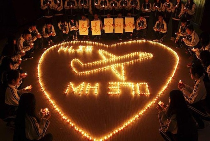 School students during a prayer for passengers aboard Malaysia Airlines flight MH370 that went missing in March.