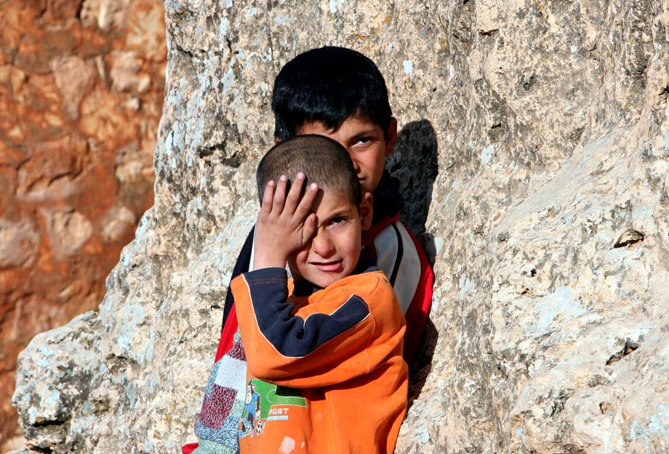 Children play in the village of Bogazkoy, as the life returns to normal a day after Turkish officials quarantined the village and culled the poultry, near the southeastern province of Batman, Turkey.