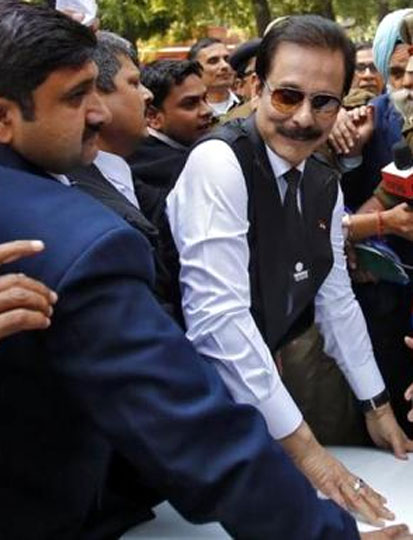 File photo of Sahara group chairman Subrata Roy (C) arriving at the Supreme Court in New Delhi on March 4, 2014.