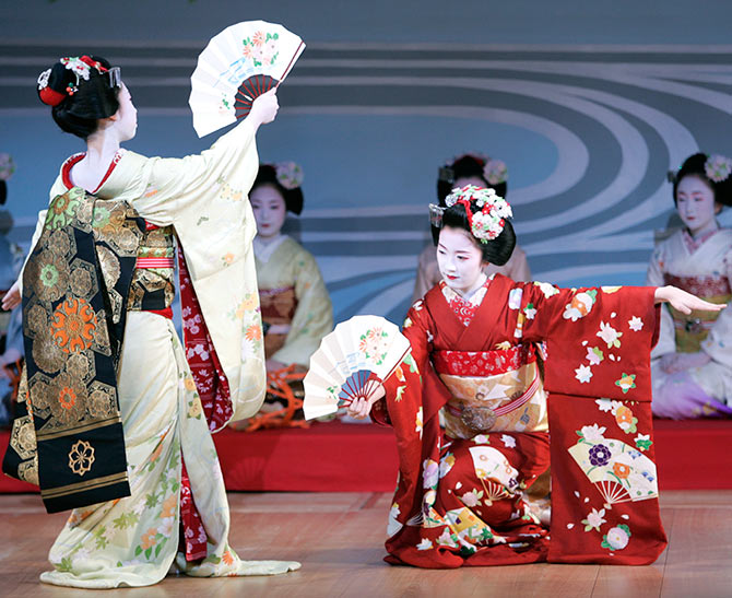Maiko, (apprentice geisha) perform during an annual spring dance performance at the Kaburenjo theatre in the Miyagawa district of Kyoto.