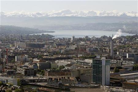 A general view shows the city of Zurich, Lake Zurich and the eastern Swiss Alps.
