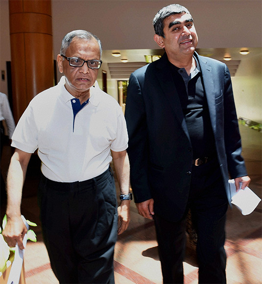 Infosys Executive Chairman N R Narayana Murthy with newly appointed CEO & MD Vishal Sikka arrives to attend a press conference at Infosys headquarters in Bengaluru.