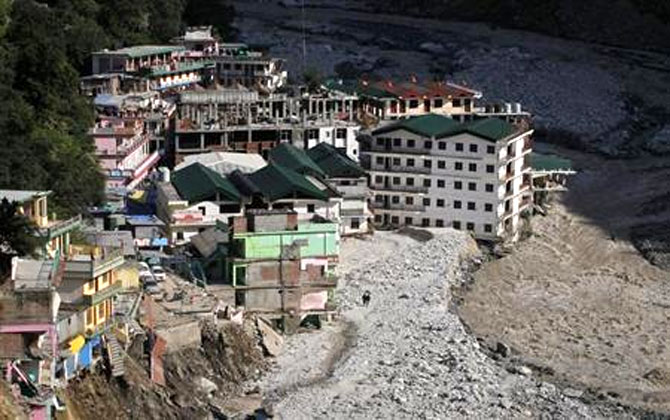 Buildings destroyed during floods are seen next to the Alaknanda river in Govindghat in Uttarakhand on June 22, 2013.