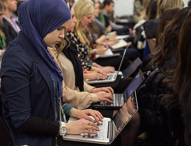 Attendees use their computers during a seminar at Social Media Week held in the Manhattan borough of New York.