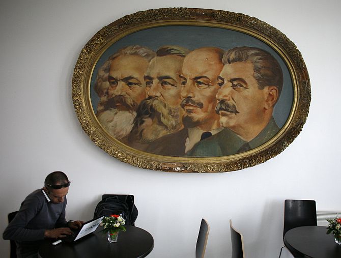 A man works on a laptop in a cafe of the newly opened Museum of Socialist Art in Sofia.