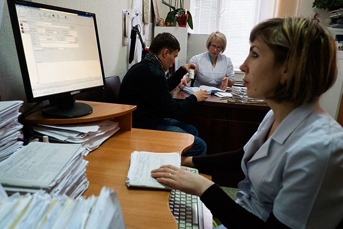 A doctor uses computer at the state-run Lavra clinic in Kiev.