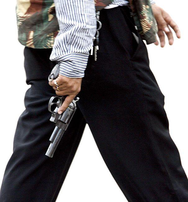 A member of India's anti-terror squad carries a gun.