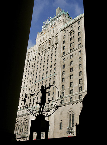 The historic Fairmont Royal York Hotel is photographed through Union Station's stone columns in Toronto.