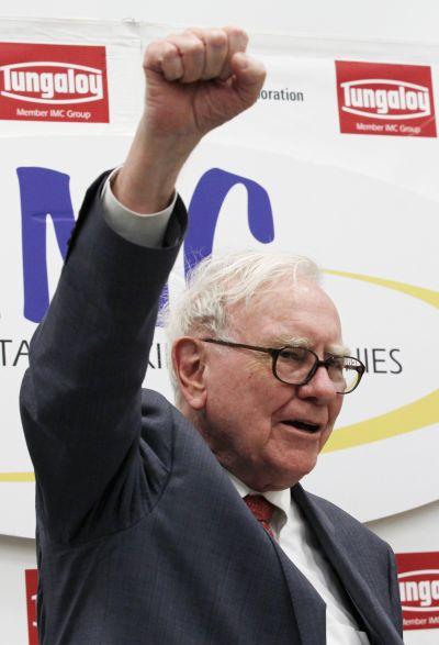 Berkshire Hathaway Chairman Warren Buffett shouts the slogan Never give up, Iwaki in Japanese, in response to a request from a local television reporter.