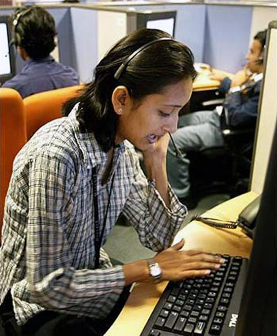 An Indian employees at a call centre provide service support to international customers.