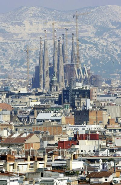 Gaudi's Sagrada Familia and Barcelona's skyline are seen against the backdrop of snow-covered Tibidabo mount after a snowstorm.