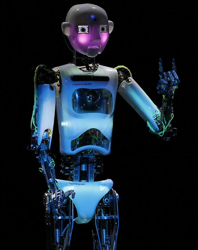 Humanoid robot of British company RoboThespian 'blushes' during the opening ceremony of the Hanover technology fair CeBIT in Germany.