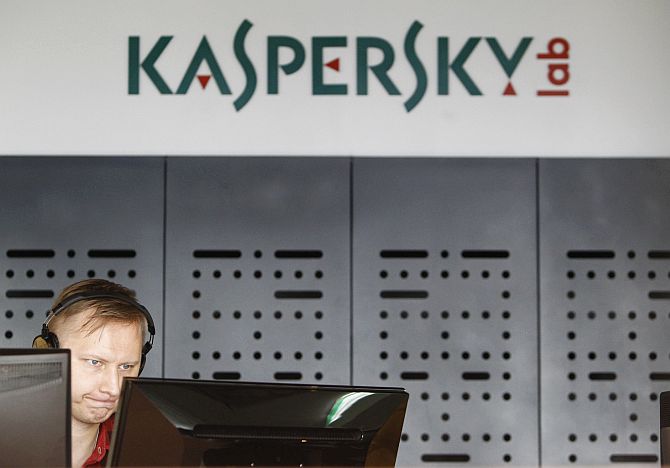 An employee works near screens in the virus lab at the headquarters of Russian cyber security company Kaspersky Labs.