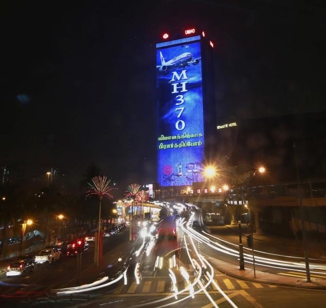 A 'Pray for MH370' projection is seen on the Putra World Trade Centre building in Kuala Lumpur