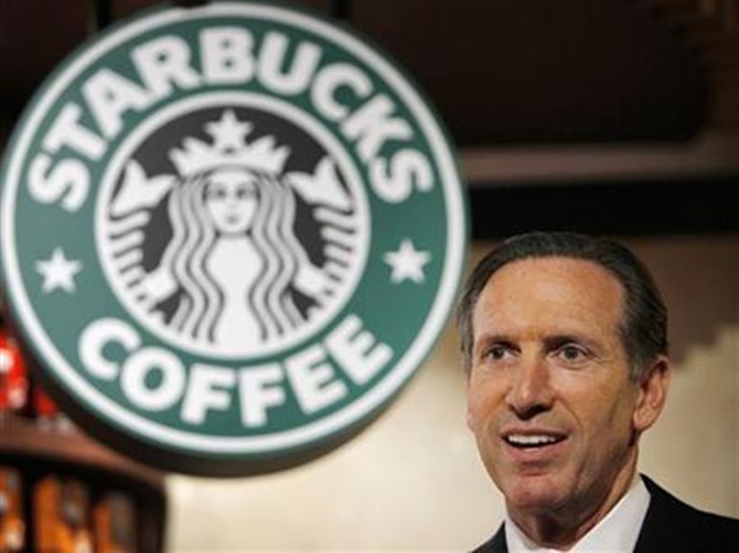 Starbucks Chief Executive Howard Schultz attends a news conference in Tokyo.