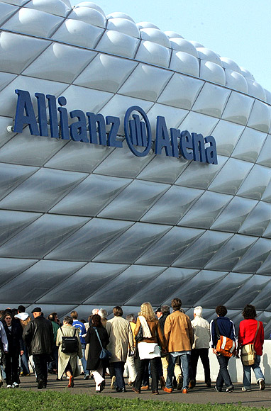Visitors enter the newly built soccer stadium Allianz Arena.