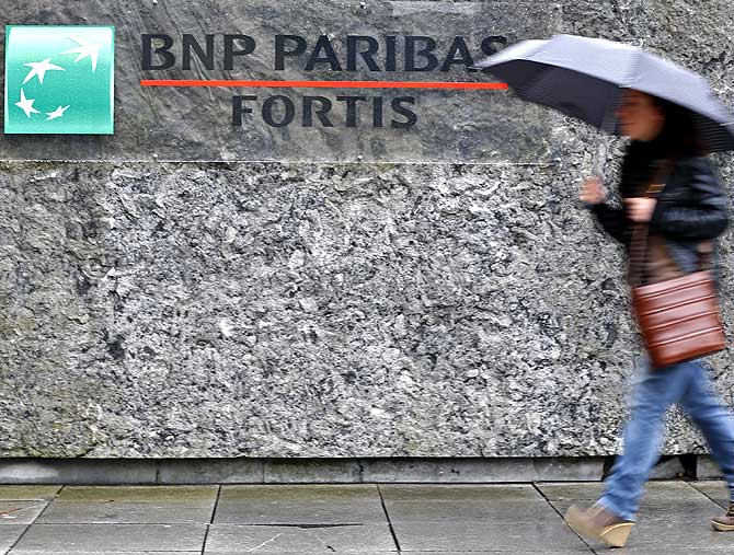 A woman arrives at BNP Paribas Fortis headquarters in Brussels.