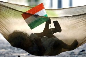 A child holds a national flag.
