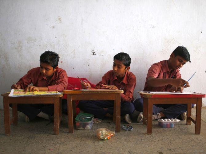 Muslim boys attend a painting class at a school in the Muslim dominated Johapura area in the western Indian city of Ahmedabad.