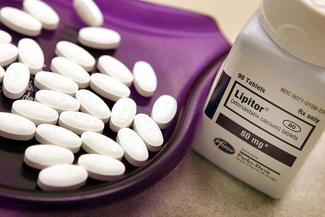 Lipitor tablets sit in a tray at a Pharmacy.