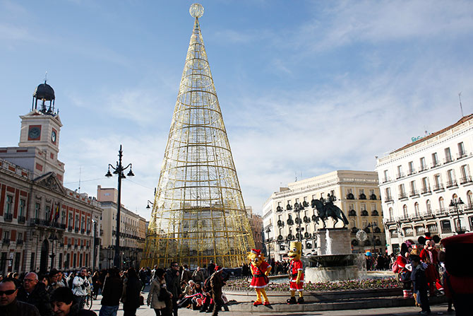 People shop in Madrid's Puerta del Sol square.
