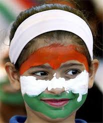 A child wears colours of Indian flag.