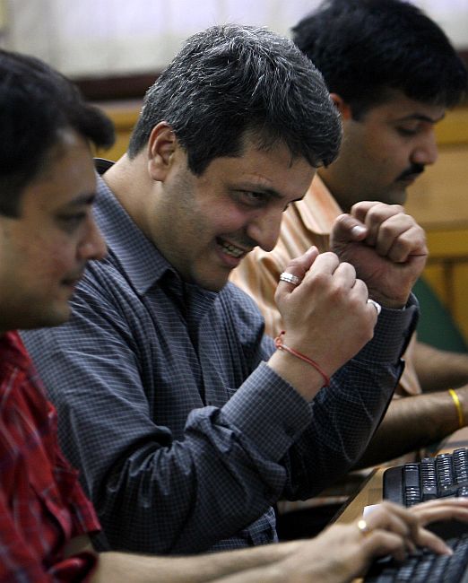 A broker reacts during trading at a stock brokerage firm in Mumbai.