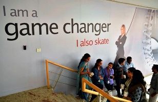 Employees chat with each other during lunch hours at the Indian headquarters of iGate in Bengaluru.