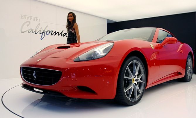 A model poses near the new Ferrari California car. 