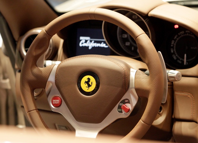 The dashboard of Ferrari California car is displayed at an exhibition. 