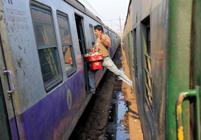 A vendor moves from one train to another at a railway station in Kolkata. Rupak De Chowdhuri/Reuters