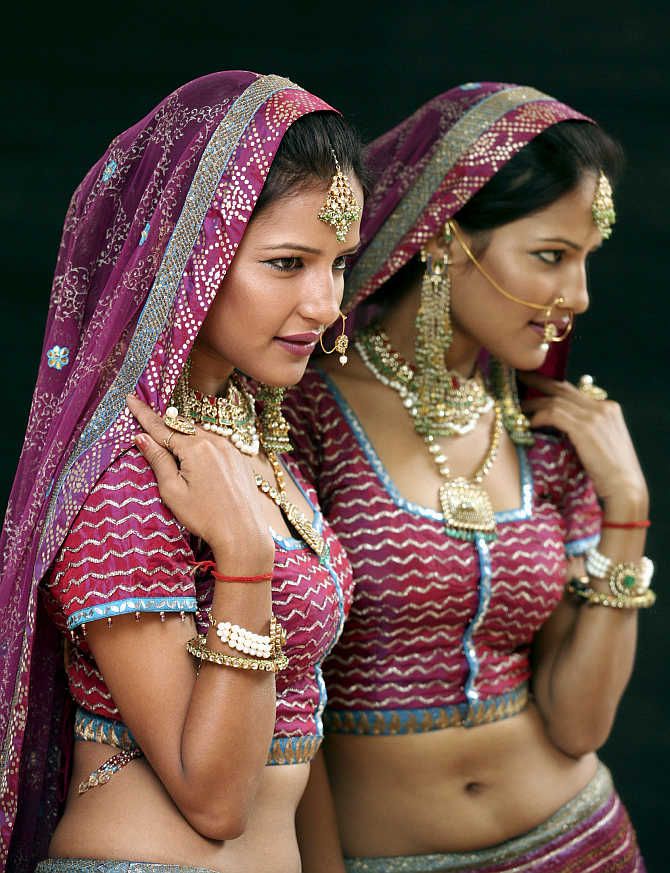 A model displays jewellery during an exhibition