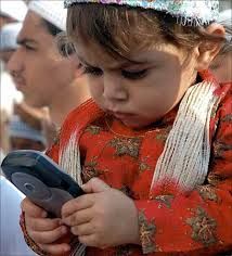 A child plays with a mobile phone