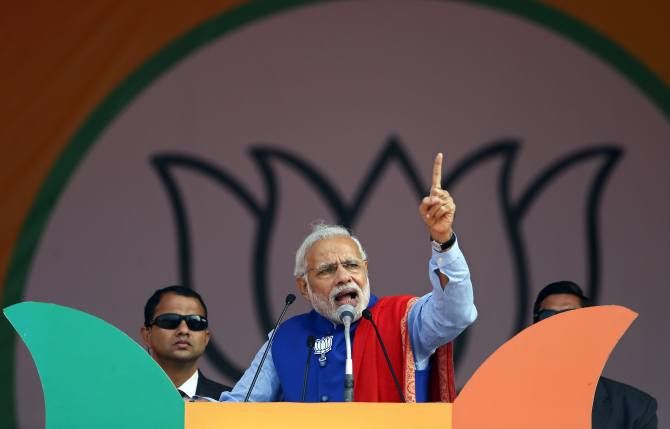 Indian Prime Minister Narendra Modi addresses a campaign rally ahead of state assembly elections, at the Ramlila ground in New Delhi, January 10, 2015.