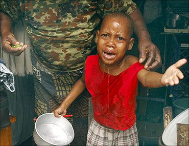 A child cries in a refugee camp.