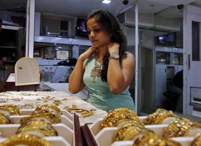 A customer tries out gold jewellery