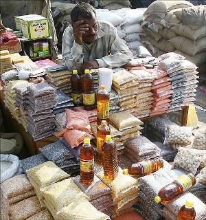 A salesman waits for customers at a grocery wholesale market in Chandigarh.