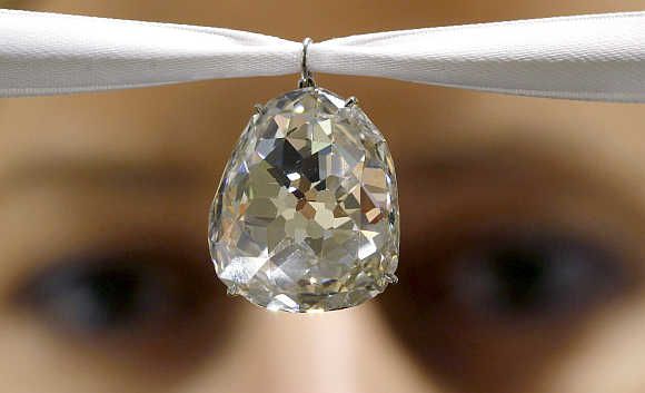 An employee of Sotheby's auctioneers displays the Beau Sancy diamond in Zurich, Switzerland. 