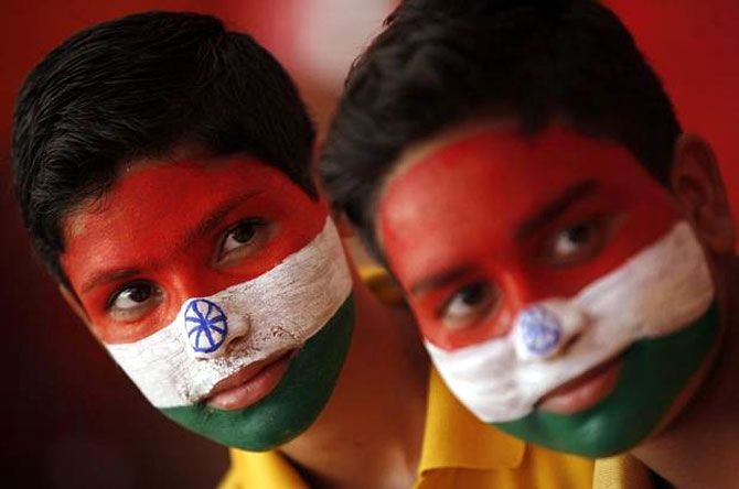 School boys with their faces painted in the colours of India's national flag, take part in Independence Day celebrations in Jammu.