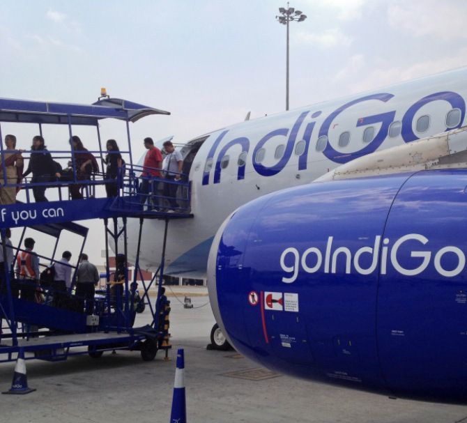 Passengers disembark from an IndiGo Airlines A320 aircraft at Bengaluru International Airport in Bengaluru.